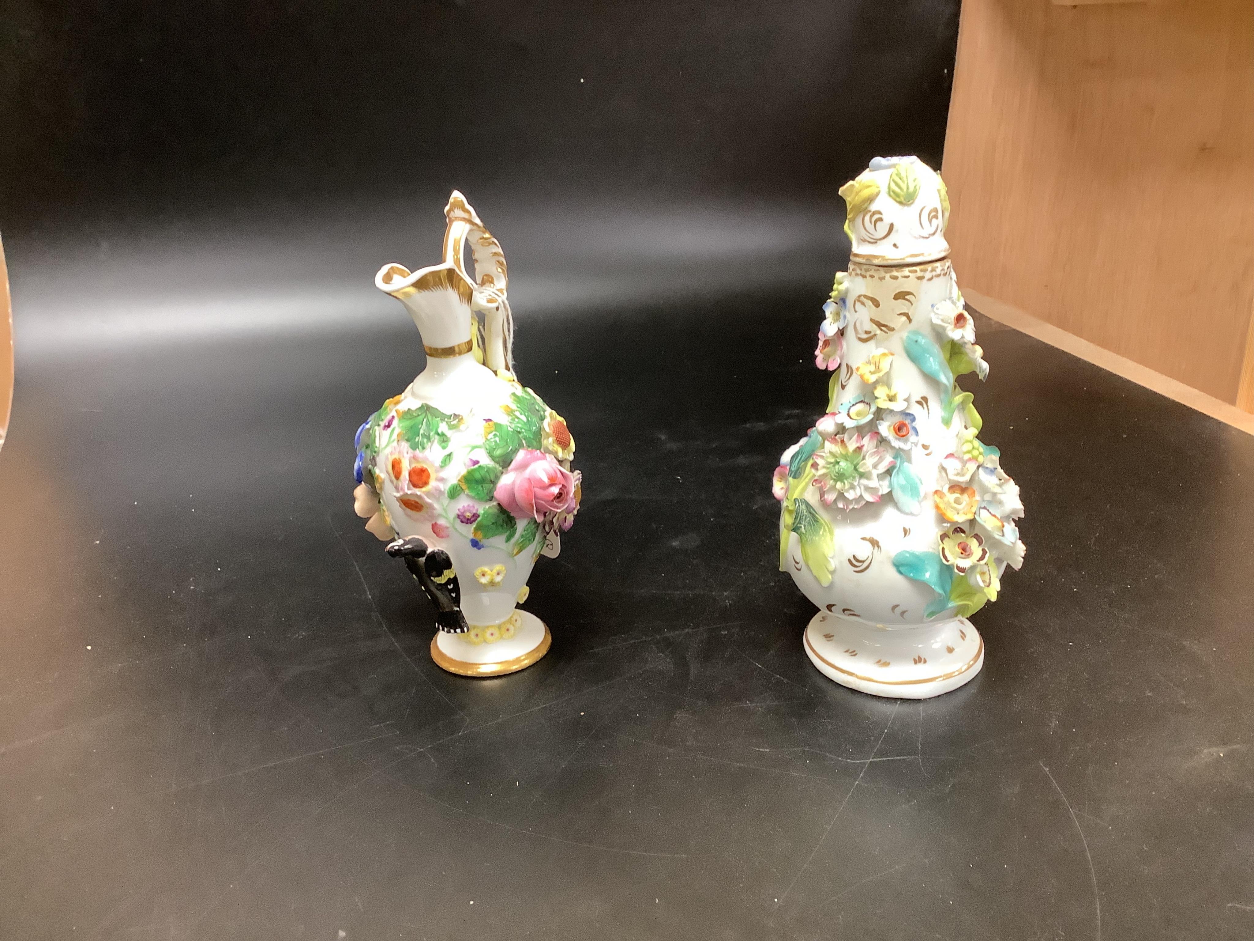 A group of English porcelain flower encrusted scent bottles and yours, Coalport, Minton etc., c.1830-50 together with Continental porcelain figures a wall pocket etc, largest 26cm high